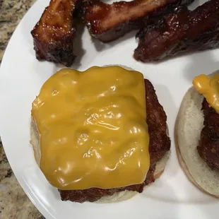 a hamburger and bacon on a bun