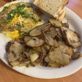Green chili pork with home fries and sourdough toast