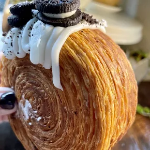 a croissant with oreo cookies on top