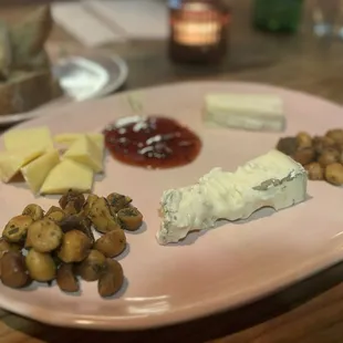 Cheese Platter with red currant and roasted macadamia.