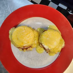 Eggs Benedict... served with home fries.