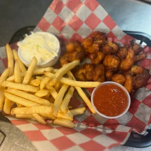 a basket of fried chicken and fries