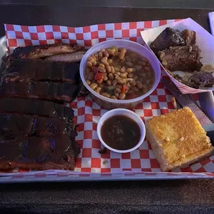 Ribs, brisket, beans and corn bread.