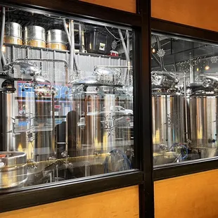 a row of stainless steel tanks