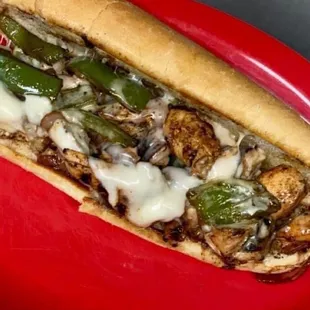 a red plate with a sandwich on it