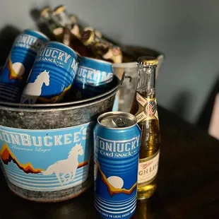 a bucket of beer and a can