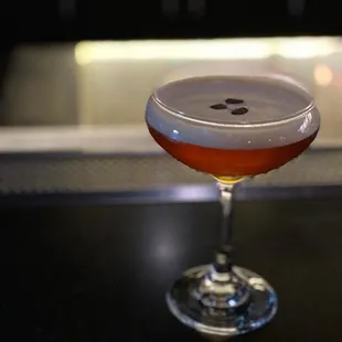 a cocktail in a coupe glass