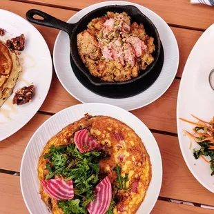 plates of food on a wooden table