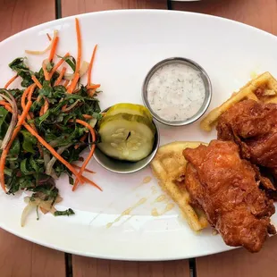 a plate of fried chicken and waffles