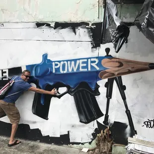 a man holding a pair of scissors