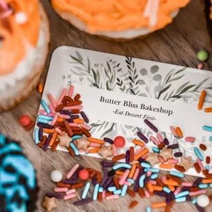 a business card surrounded by sprinkles