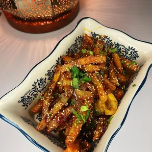 Curbside Chilly Potato - (Golden fried crispy potato fingers seasoned to perfection)