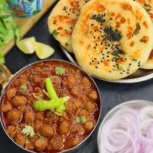 Chickpea Kulche - House made cheakpea stew with Indian spices and side of Kulcha Naan bread.