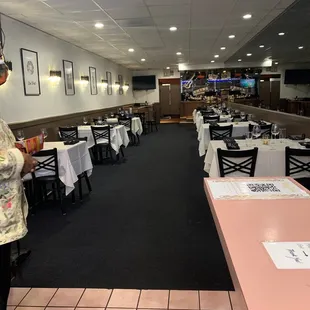 a woman standing in the dining room