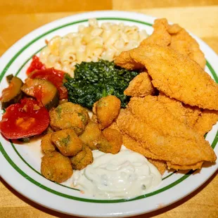 a plate of fried fish and vegetables