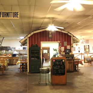 Dining room is broken up by 'barn' waitress station.