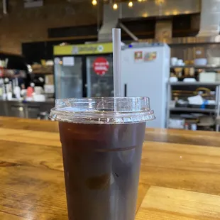 a cold beverage in a plastic cup