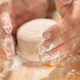 hands in flour