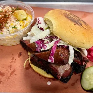 The "El Barracho" 2-meat sandwich, with brisket and house-made sausage, and a side of eloté. Freakin' delicious!