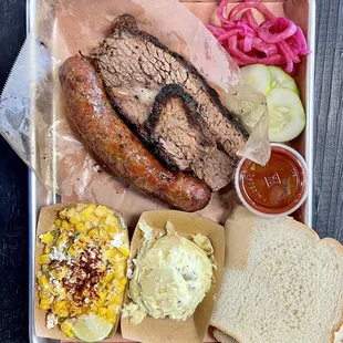 2-meat plate with moist brisket &amp; jalapeño cheddar sausage for meats, elotes &amp; potato salad for sides.