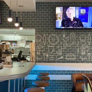 Diner counter with cool wall graphics.