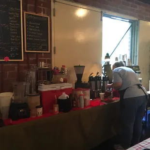 a woman standing at a counter