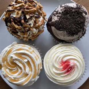 Top row: chocolate pretzel cupcake (left), cookies and cream (right)  Bottom row: salty caramel (left), red velvet (right )