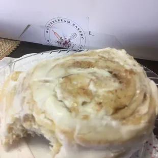 a cinnamon roll with a bite taken out of it