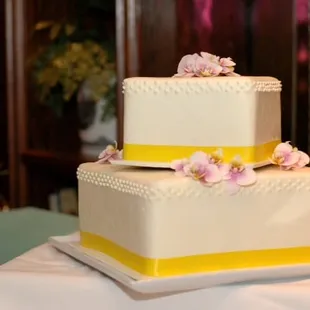 2-tier wedding cake by Buttercream (October 2011).  We used our own orchids.