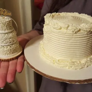 Tiny clay model of our actual cake next to our complimentary 1 year anniversary cake!