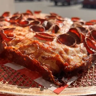 a slice of pizza on a plate