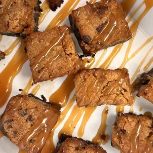 a plate of brownies with caramel drizzle