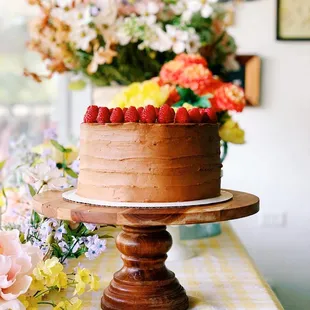 a chocolate cake with strawberries on top