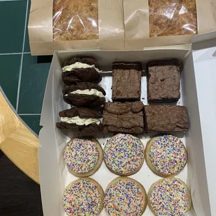 Delicious focaccia bread, moist brownie cookies with icing inside, brownies and shortbread cookies with icing &amp; sprinkles.