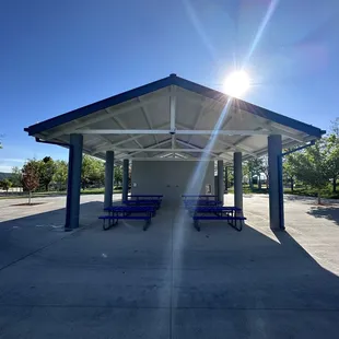 Park pavilion with picnic tables.