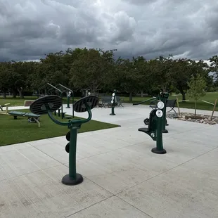 Exercise area in the park.  They offer various machines to get your daily exercise done.