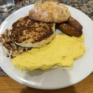 Scrambled eggs link sausage hash browns and a huge biscuit