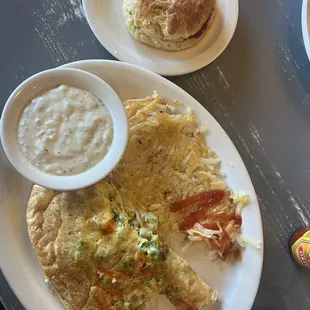 Broccoli cheddar omelette, hash browns, biscuit and side of sausage gravy