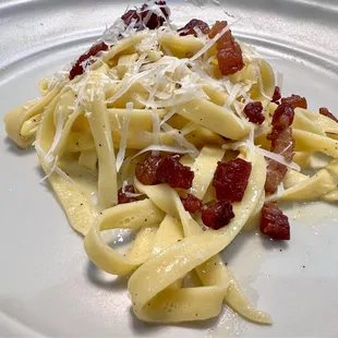 Handmade and homemade pasta carbonara with lardons and