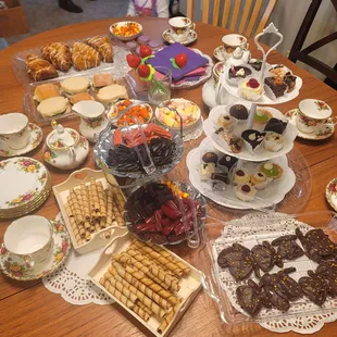 a table full of desserts and pastries