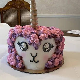 a unicorn cake on a table