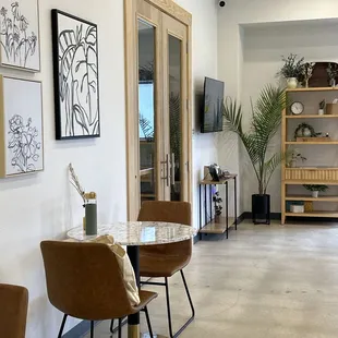 two chairs and a table in a living room