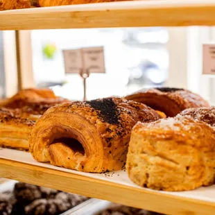 assorted pastries, including buttermilk biscuits&amp; ham and cheese croissants front &amp; center