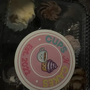 Smashed box of mini cupcakes.