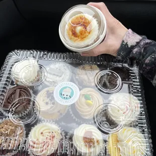 Assortment of cupcakes.  The one in my hand is creme brûlée.