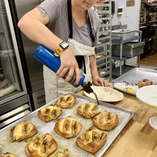 a woman making pastries