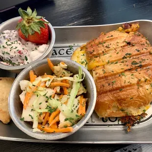 Chicken and cheese sandwich with pasta slaw and some sort of fluffy berry dessert