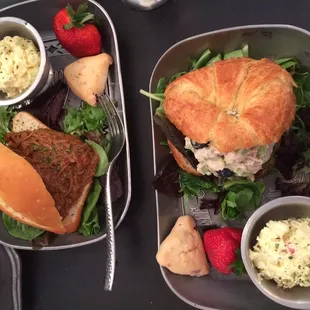 Chicken salad sandwich came with a little scone, strawberry, and potato salad on a metal plate keeping with the colonial theme