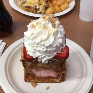 Corned beef hash egg benny with tater tots and the strawberry cheesecake french toast
