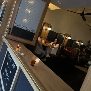 a man sitting at a counter in a restaurant